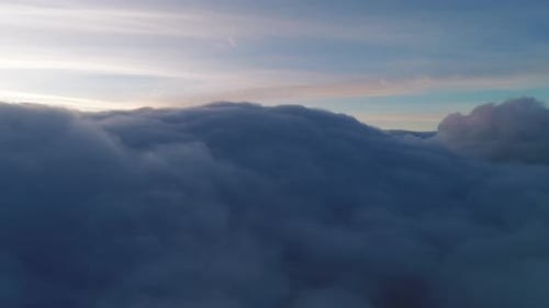 Breathtaking Aerial View of Clouds During Sunrise