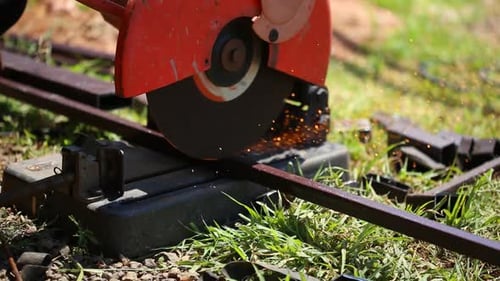 Worker cutting metal and spark with cutting machine