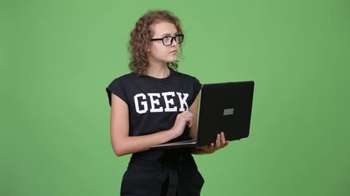 Young Woman Thinking While Using Laptop Computer