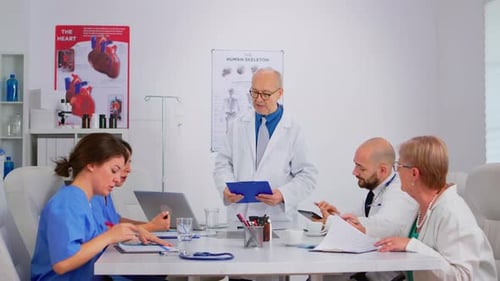 Medical Team Having Dynamic Discussion in Doctor's Office