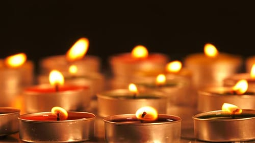 Candles Flicker in the Dark, Creating Cozy Mood