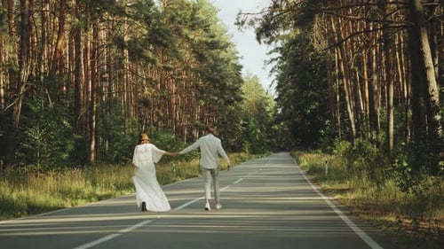 Beautiful Couple in Love Walk in Beautiful Place Hold Hands Man and Woman Hugging and Enjoying