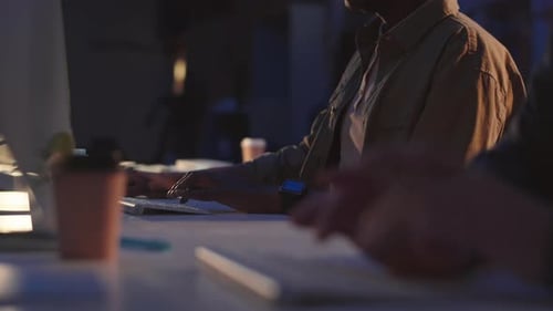 Hands of Programmers Typing in Dark Office