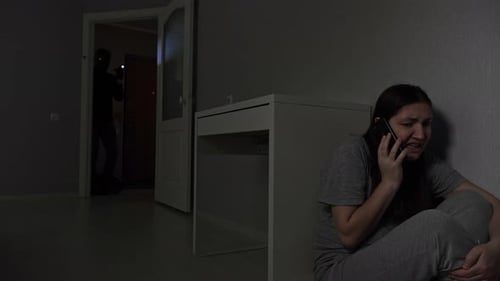 Distressed Woman on Phone While Burglar Enters