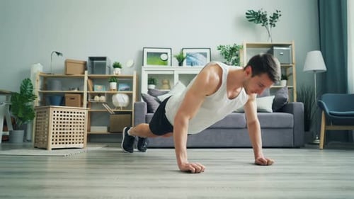Man Doing Pushups in Home Living Room