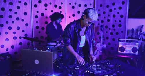 Music band recording song in boutique recording studio