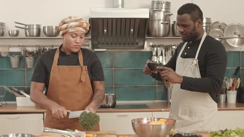 Two Friends Preparing Food in Kitchen