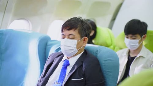 People Sitting in Seats on an Airplane