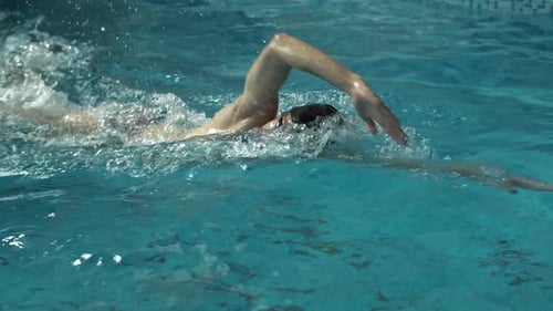Man Swimming in the Pool