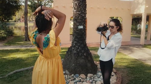 Attractive Model Posing for Photos in Tropical Garden