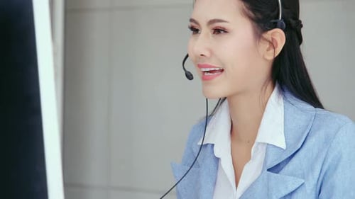 Customer Support Agent or Call Center with Headset Talking to Customer on Phone