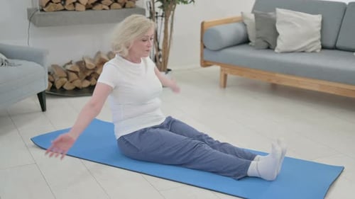Blonde Woman Exercising on Yoga Mat in Living Room