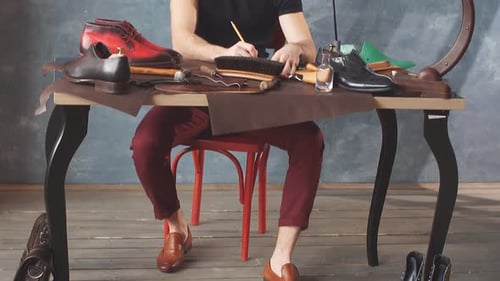 Shoemaker at Work Designing Bespoke Leather Shoes
