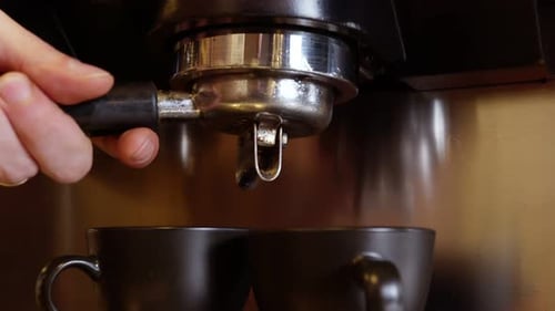 Waitress Pluging A Tamper To Press Barista Coffee Machine