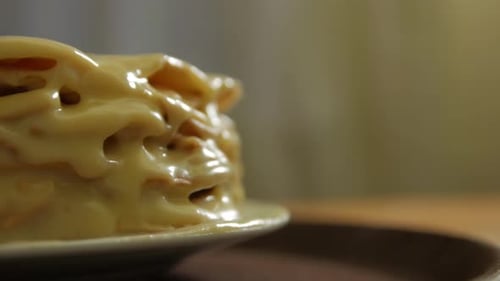 Close-up of Creamy, Layered Cake on Plate