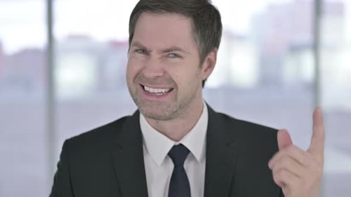 Man In Suit Speaking Angrily Close Up