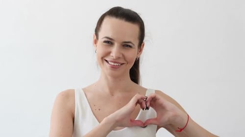 Woman Making Heart Shape With Hands