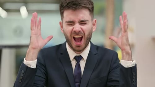 Man in Suit Screams in Frustration, Then Smiles