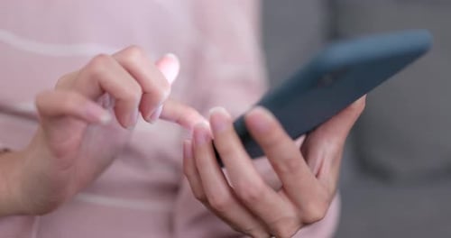 Woman Using Mobile Phone with Fingers Close Up