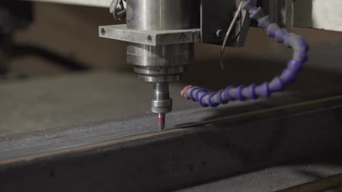 CNC Milling Machine in Operation Cutting Steel in a High-tech Machineshop