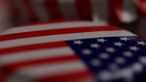 Rotating shot of bottle caps with the American flag printed on them - BOTTLE CAPS 045