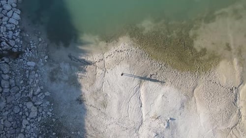 Person Standing Near Rural Lake Aerial View