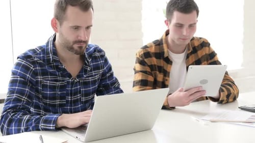 Team Celebrates Success in Modern Office Setting