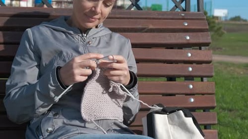 Woman Smile and Knit.
