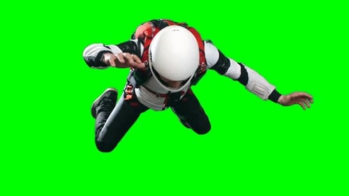 Skydiver in White Helmet Falling on Green Screen