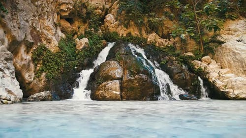 Picturesque Waterfall Flowing over Rocks