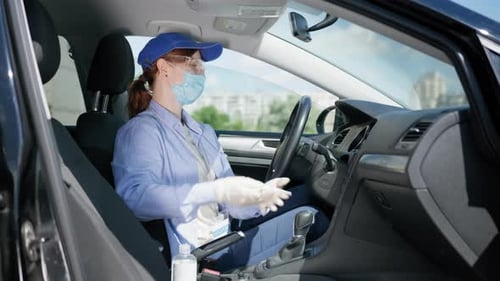 Woman Cleans Car Interior During Pandemic