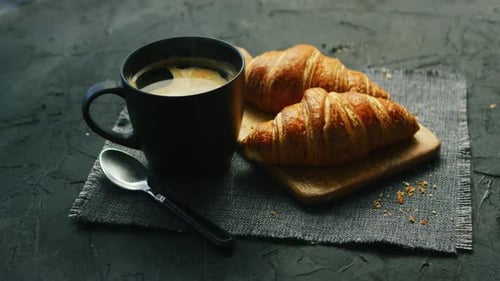 Coffee and Croissants Still Life on Gray Surface
