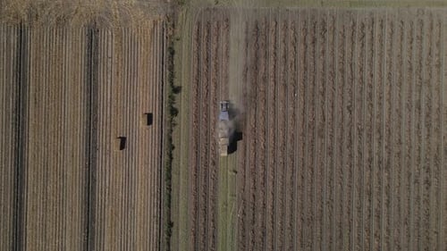 Aerial View of Tractor Making Bales of Hay