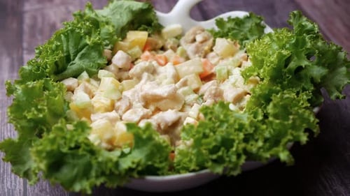Chicken Salad with Lettuce Being Scooped by Spoon