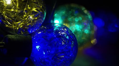 String of Decorative Christmas Lights Glowing at Night