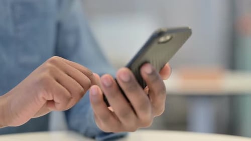 African Man Hands Using Smartphone Close Up
