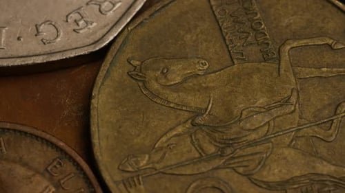 Rotating stock footage shot of international monetary coins