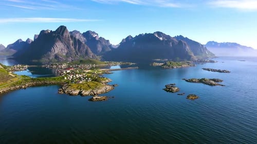 Coastal Village Amongst Jagged Mountains and Blue Waters