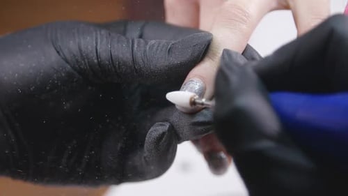 Closeup Slow Motion Shot of Hardware Manicure in a Beauty Salon