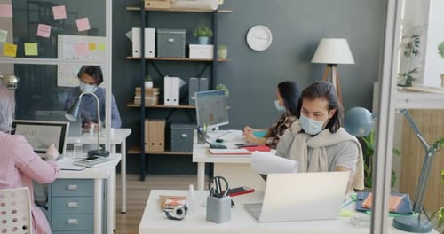 Group of People Colleagues Working with Computers at Desks in Office