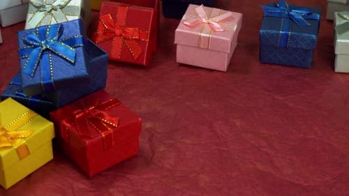 Colorful Gift Boxes Stacked on a Red Background