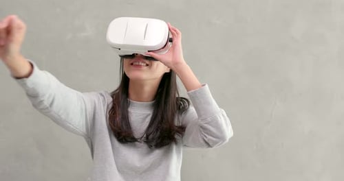 Woman Experiencing Virtual Reality with VR Headset