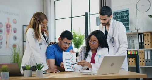 Doctors Holding Video Meeting Via Computer in Medical Room and Explaining Results of DNA Infografics