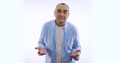Portrait of Man Expressing Frustration Over White Background. Concept of Emotions.