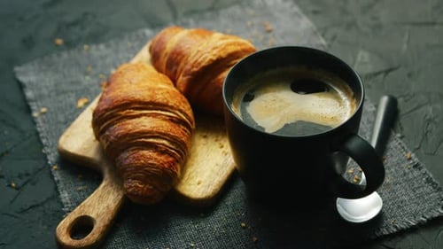 Coffee and Croissants on Dark Background