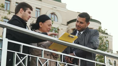 Business People Collaborating in Urban Environment