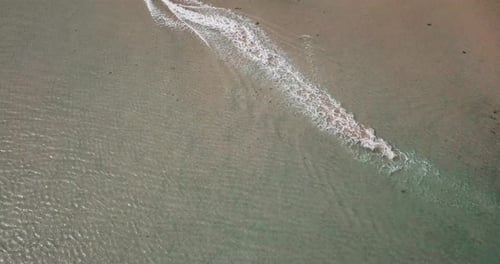 Beautiful beach with sea transparent clean water on both sides. Island concept travel destination.