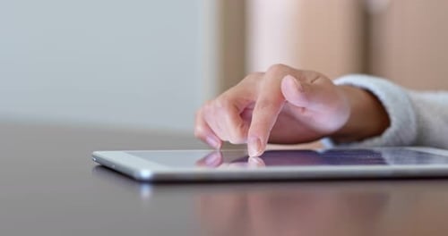 Hand Interacting with a Tablet Device Indoors
