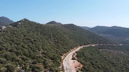Motorcycling on Mountain Forest Driveway Aerial 4K
