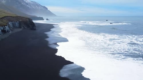 Volcanic Landscape in Iceland Sea Waves on Black Sand Beach Bird's Eye Aerial View of Ocean Waves